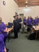 Ann-Charlotte Campos-Cornell leading the warm-up for the choir